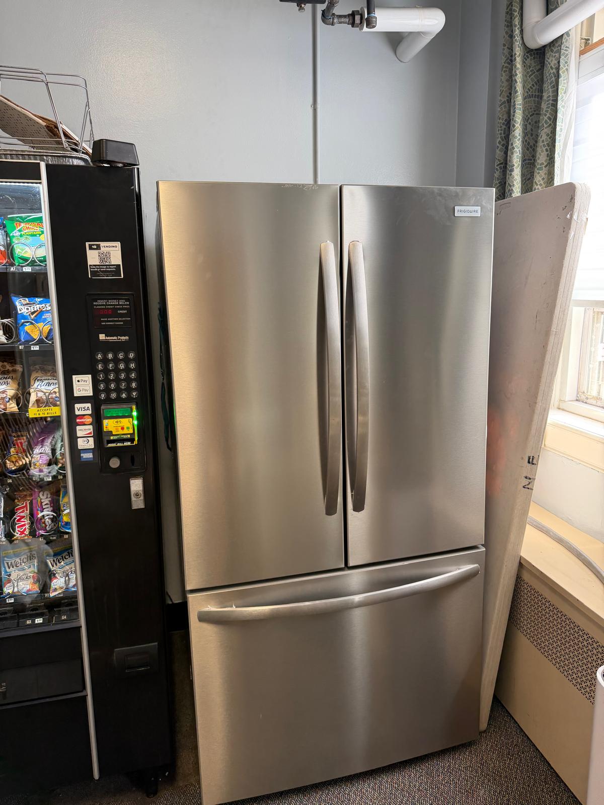 The brand-new refrigerator installed in the refreshed teacher lounge